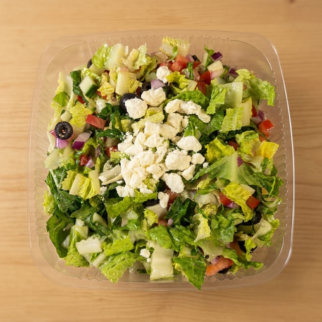 Greek Salad -- (Lettuce, Onions, Tomato, Cucumber, B Olives, and Feta with Greek Dressing).